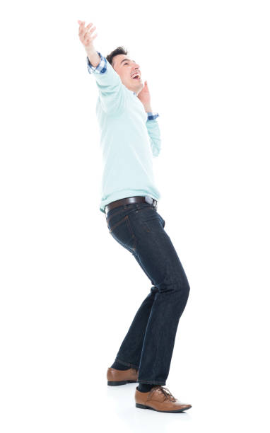 istock Handsome young man looking up in surprise 1047791910