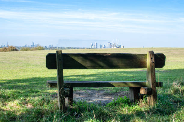 istock A wooden bench overlooking the distant London skyline 1047792222