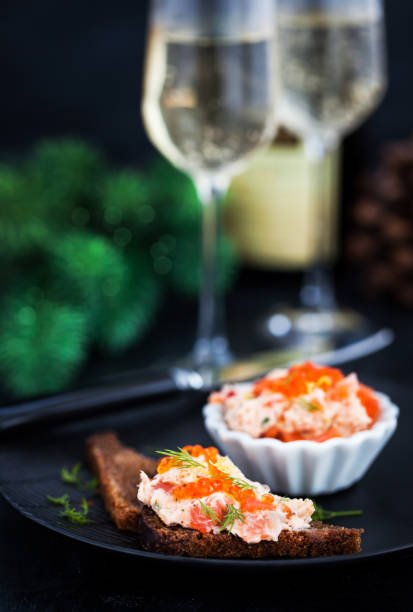 istock Salmon pate (rillettes) with red caviar served with sliced bread 1047795430