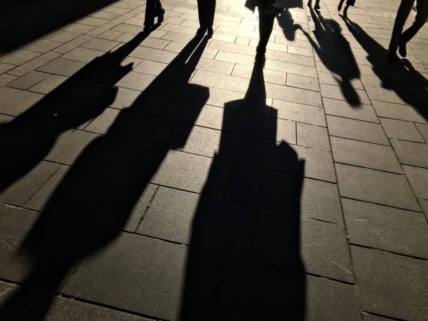 istock Shadows of people 1047799508