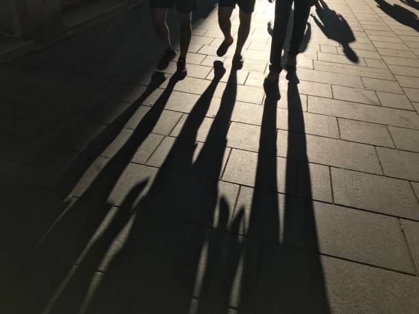istock Shadows of people 1047799540