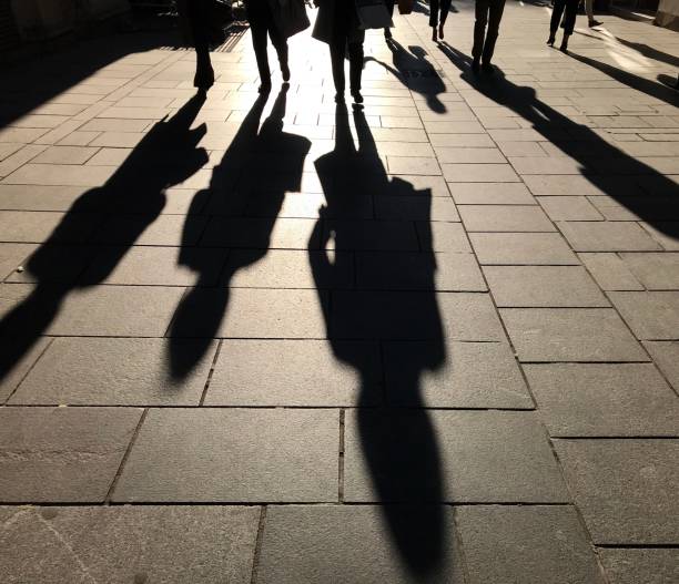 istock Shadows of people 1047799700