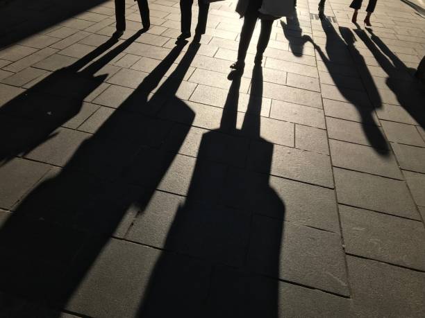 istock Shadows of people 1047801572