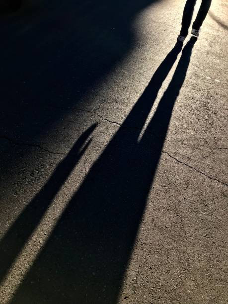 istock Shadows of people 1047801596