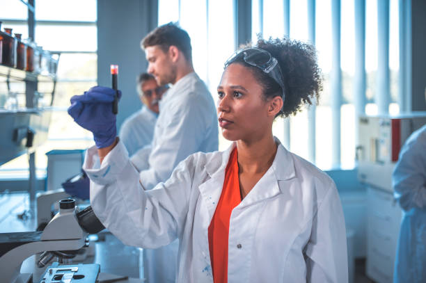 istock Scientist looking at blood sample in laboratory 1047801638