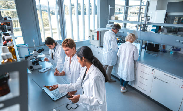 istock Researcher discussing with colleague in laboratory 1047801736