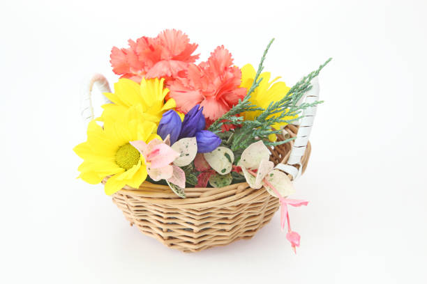 Pictured a flower basket in a white background.