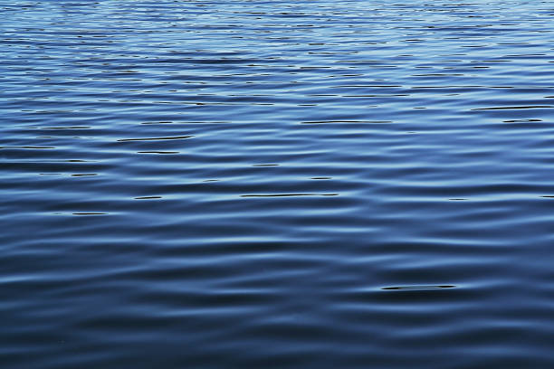 Soft blue waves - water surface on sea stock photo