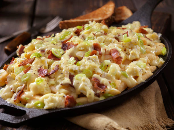 Breakfast Poutine with Hollandaise Sauce, Scrambled Eggs, Bacon and Cheese Curds
