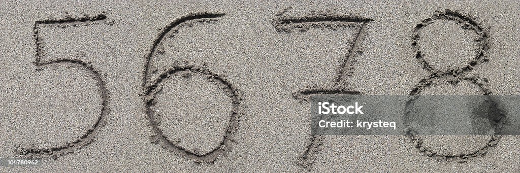 Sand Alphabet XXXL 5-6-7-8 digits. Beach Stock Photo