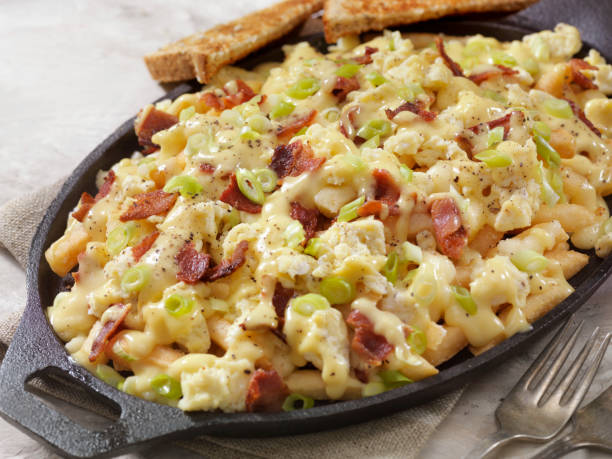 istock Breakfast Poutine with Hollandaise Sauce, Scrambled Eggs, Bacon and Cheese Curds 1047810130