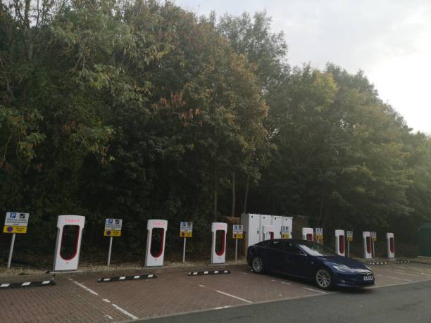 Tesla Charging on the Tesla Charge point in West Midlands Service in M40 After Gaydon before Warwick exit Warwickshire, UK - October 1st, 2018 : Tesla Charging on the Tesla Charge point in West Midlands Service in M40 After Gaydon before Warwick exit m40 sniper rifle stock pictures, royalty-free photos & images