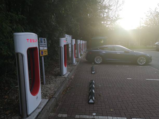 Tesla Charging on the Tesla Charge point in West Midlands Service in M40 After Gaydon before Warwick exit Warwickshire, UK - October 1st, 2018 : Tesla Charging on the Tesla Charge point in West Midlands Service in M40 After Gaydon before Warwick exit m40 sniper rifle stock pictures, royalty-free photos & images