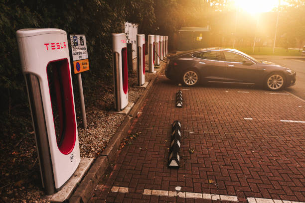 Tesla Charging on the Tesla Charge point in West Midlands Service in M40 After Gaydon before Warwick exit Warwickshire, UK - October 1st, 2018 : Tesla Charging on the Tesla Charge point in West Midlands Service in M40 After Gaydon before Warwick exit m40 sniper rifle stock pictures, royalty-free photos & images