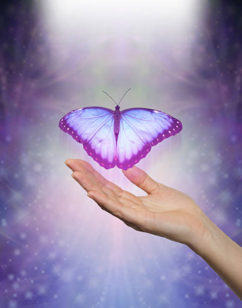 istock Spirit Release depicted by a lilac blue Butterfly taking flight 1047813956