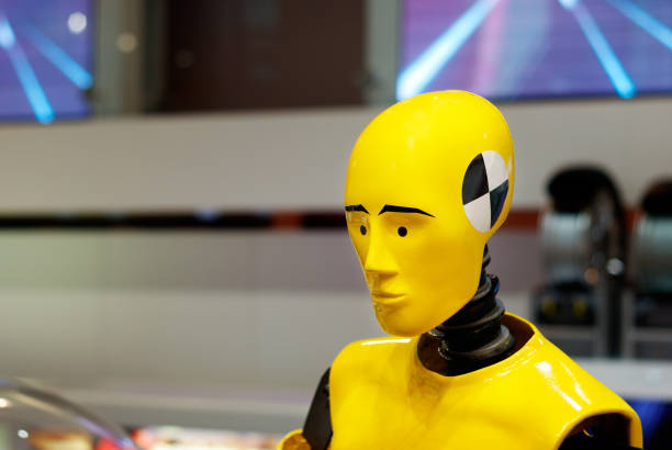 Crash test dummy Yellow crash test dummy in the middle of car safety research and test engineering factory. crash test dummy stock pictures, royalty-free photos & images