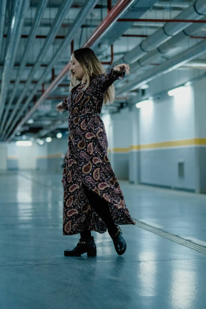 istock Beautiful woman in the garage 1047816828