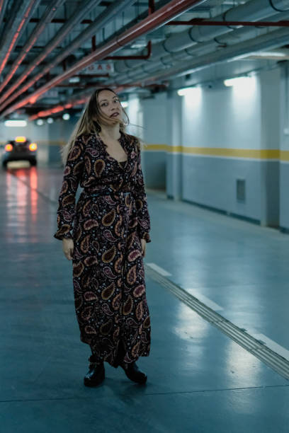 istock Beautiful woman in the garage 1047816916
