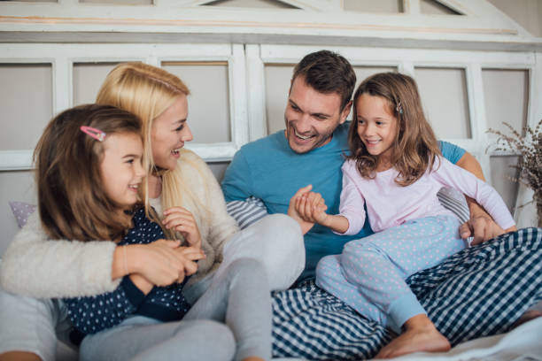 istock Parents having fun with children 1047819860