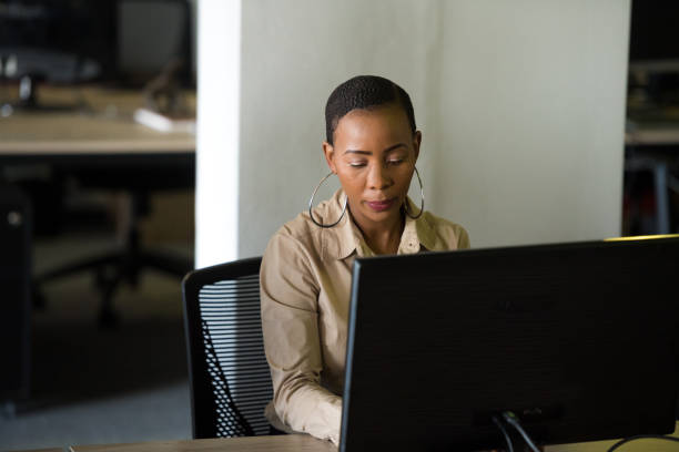 istock Successful businesswoman working at her desk 1047819924