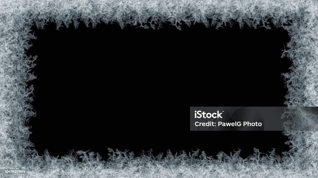 Decorative ice crystals frame on black matte background Decorative ice crystals on a window in form of a frame on black matte background Frost Stock Photo