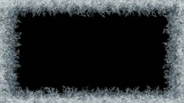 Photo of Decorative ice crystals frame on black matte background