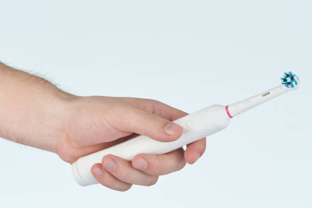 istock Hand hold electric toothbrush 1047828336