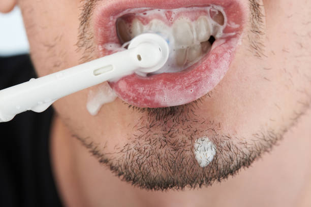 istock Mouth full of toothbrush 1047828372