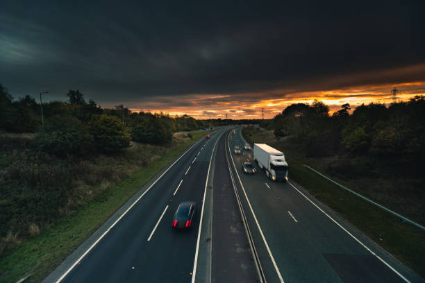 istock Headlights and Taillights on Motorway at Night in UK 1047831856