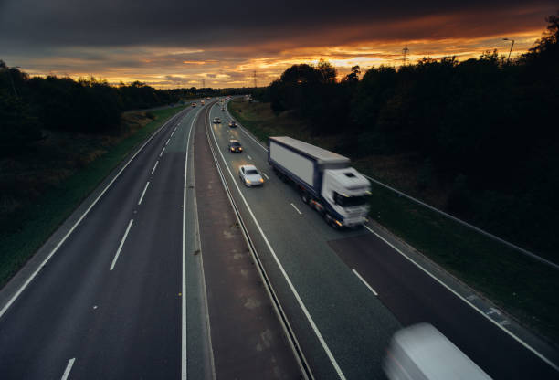 istock Headlights and Taillights on Motorway at Night in UK 1047832000