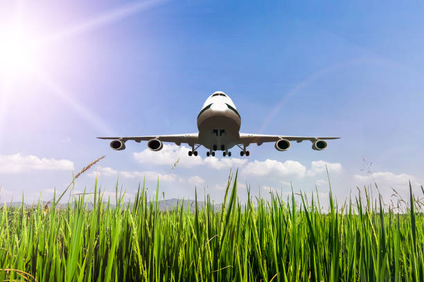 istock Airplane take off on the blue sky, big jet plane flying on blue cloudy skybackground 1047832300