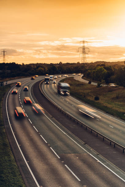 istock Headlights and Taillights on Motorway at Night in UK 1047836156