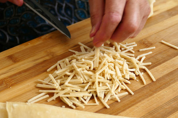 istock a housewife homemade soup cuts dough, turkey specific noodle soup paste, 1047836202