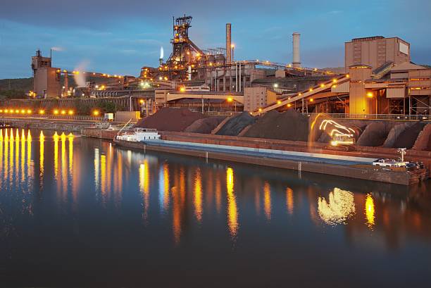 steel mill at night stock photo