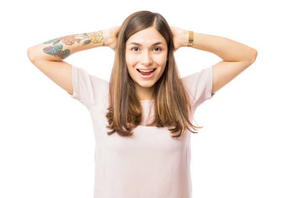 istock Excited Brunette Woman With Hands Behind Head 1047849046