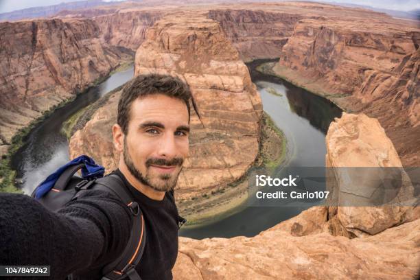 Young Adult Man Taking A Selfie At The Horseshoe Bend Stock Photo - Download Image Now