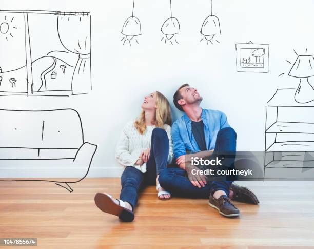 Couple Dreaming Of Their New House Stock Photo - Download Image Now - Moving House, Home Interior, Couple - Relationship