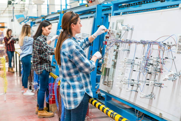 istock women working in cable factory 1047860254