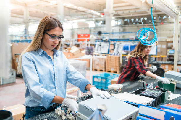 women working in cable factory - electric plug electricity women power imagens e fotografias de stock