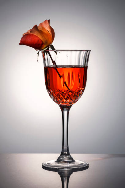 Rose in red tinted water.