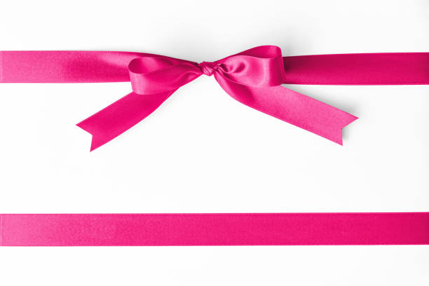 istock Pink satin ribbon stripe fabric bow isolated on white background with clipping path 1047875988