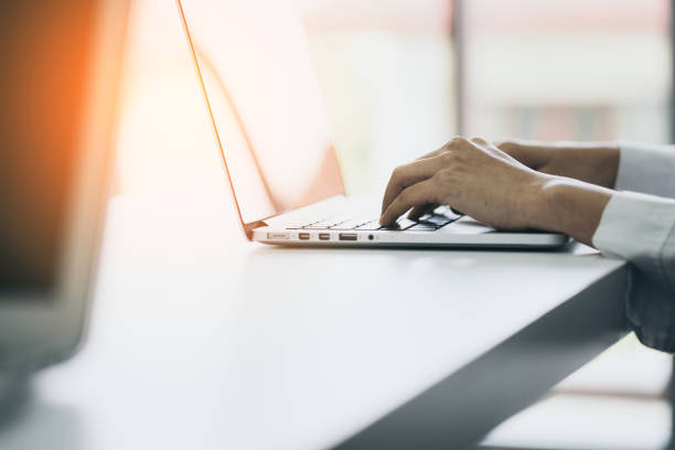 istock business working woman hand type laptop with office background 1047876630
