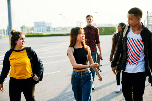 istock Group of school friends outdoors lifestyle 1047880052