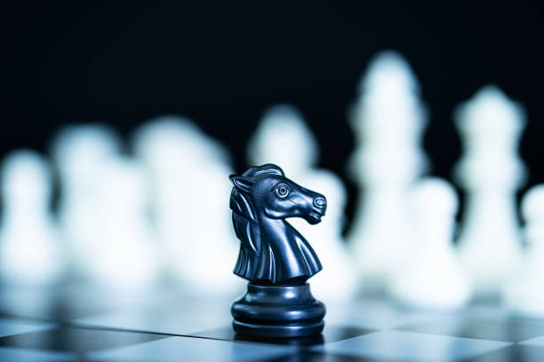 istock Close up chess pieces on chessboard 1047883928