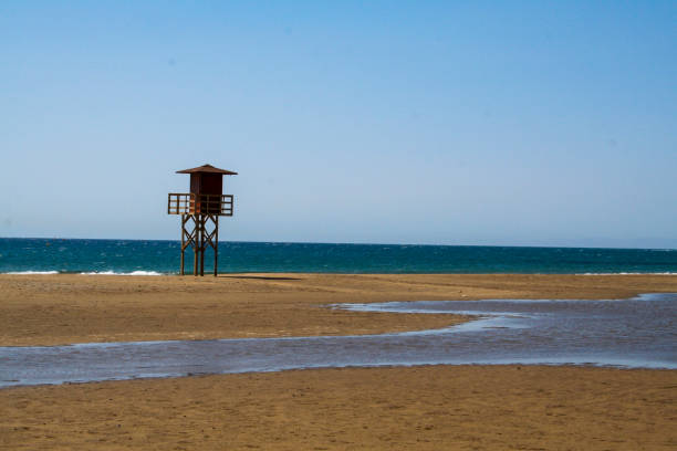 istock Lonesome post on a quiet beach in Lanzarote 1047898112