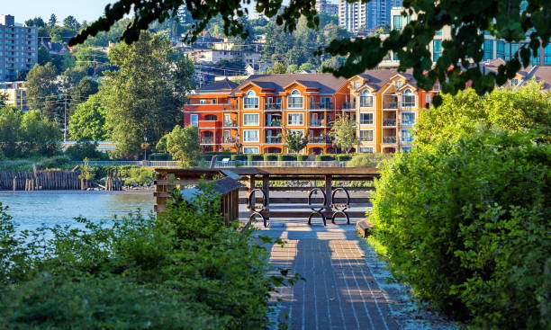 Quay Promenade Apartment Buildings and promenade quay at the waterfront of New Westminster Downtown new westminster stock pictures, royalty-free photos & images