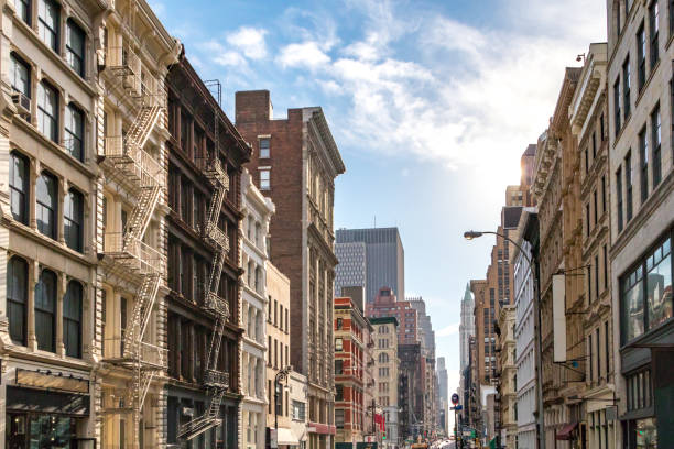 Buildings in SoHo New York City Sunlight shines on the buildings along Broadway in SoHo, New York City NYC soho new york stock pictures, royalty-free photos & images