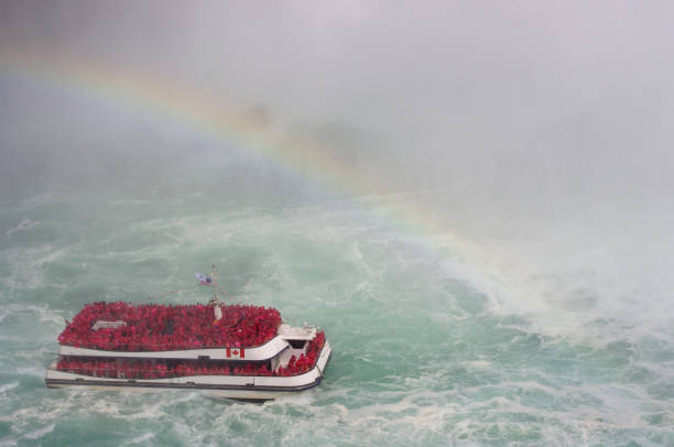 istock Tourist Boat with mist and rainbow 1047914202