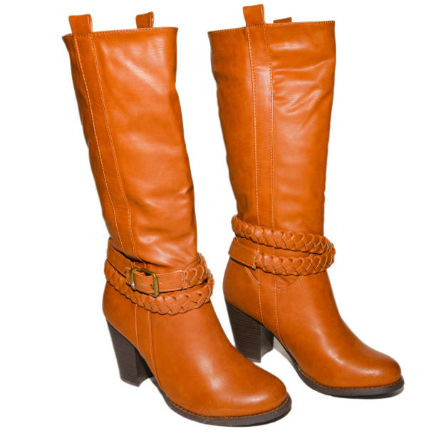 istock Leather women boots brown on heel on isolated background 1047923460
