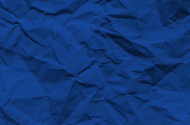 istock Deep Blue and vintage background by crumpled paper texture and free space for text. 1047930822